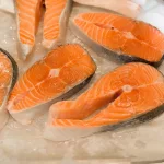 Chilled fresh salmon steak in the store, close-up. Selective soft focus